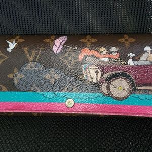 Louis Vuitton Evasion Sarah monogram wallet